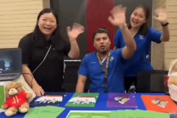 gif of nhg staff waving